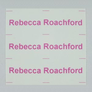 Iron-on continuous name labels on a strip printed in Pink