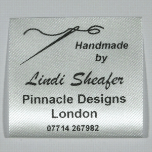 Sew in personalised Garment labels printed in Black on Silvery White material