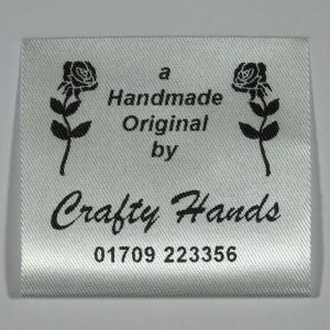 Double Rose designed sew in Label printed in Black on Silvery White material