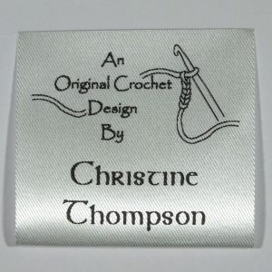 Custom printed Crochet label. Black print on Silvery White material