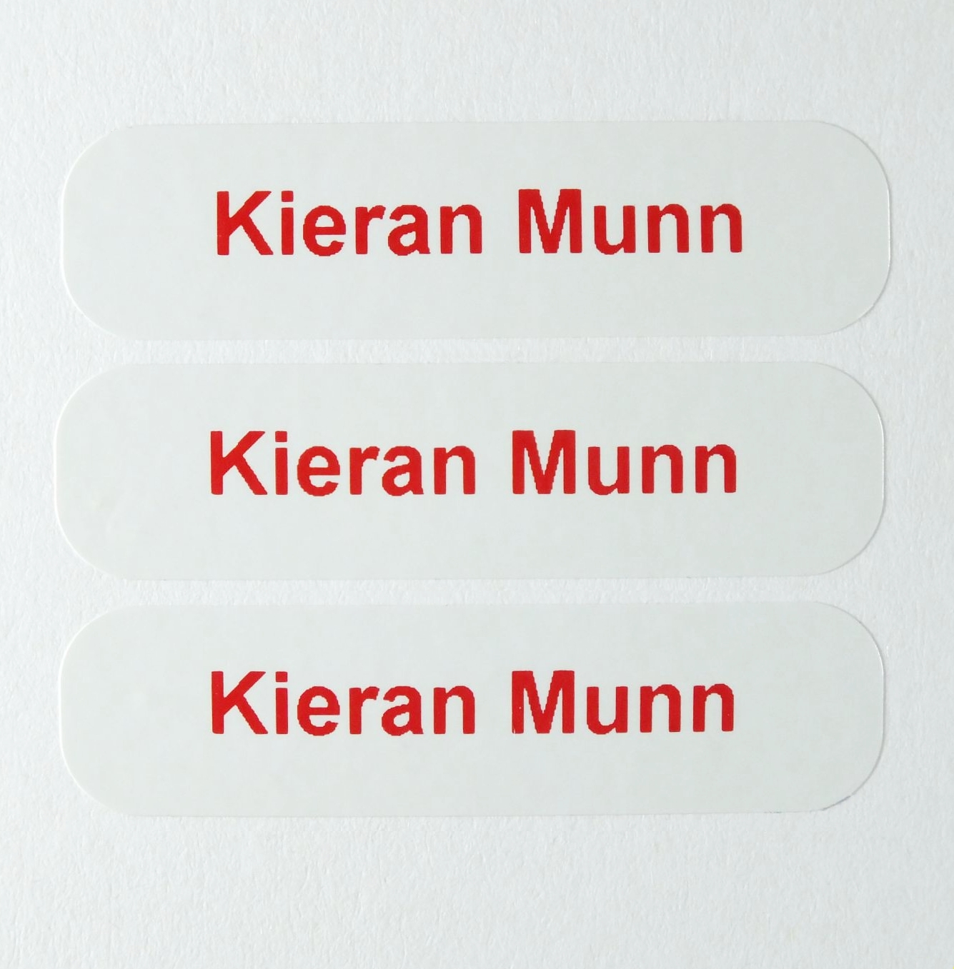 Personalised plastic label printed with your name.