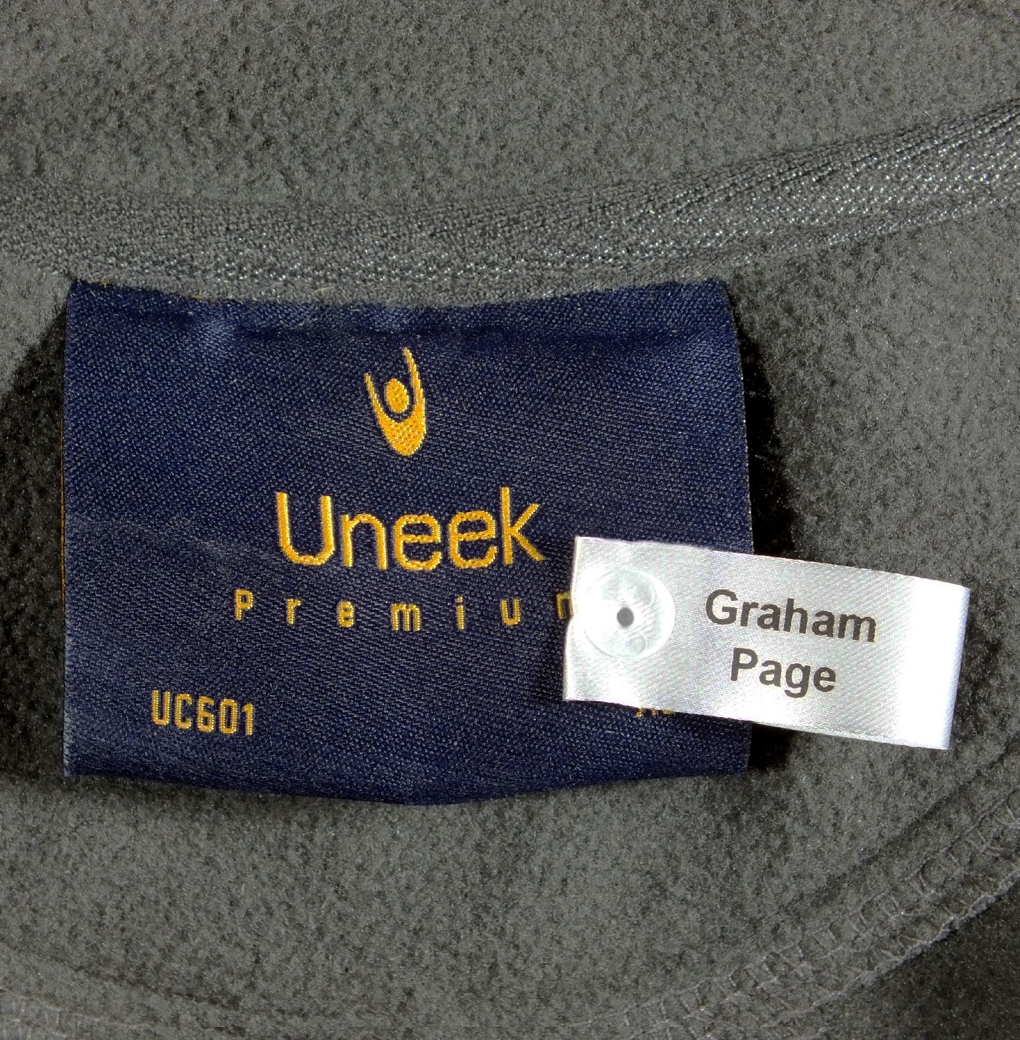 Taggit used to fix name tag to garment, fast and secure (nametapes purchased separately).