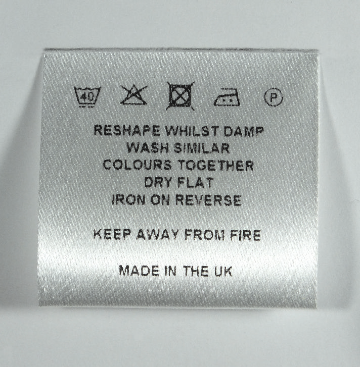 Sew in silver-white soft satin loop fold care label.