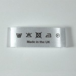 45mm wide end sewn washcare label printed Black.